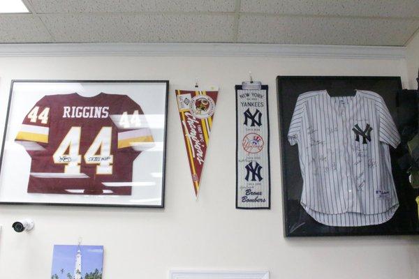 Lots of signed sports memorabilia.