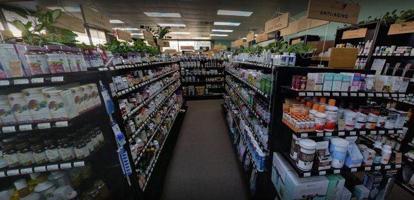 one of many supplement aisles, love the plants on top of every aisle!