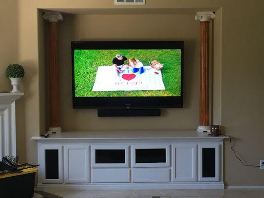 Mounted 60" T.V. with Yamaha Sound bar. Customers were definitely satisfied with their system.