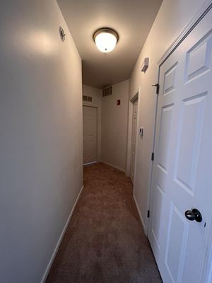 Soft lighting makes this hallway especially cozy.