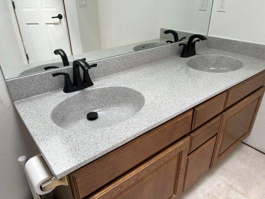 Resurfaced cultured marble vanity top. Repaired a huge crack in one bowl