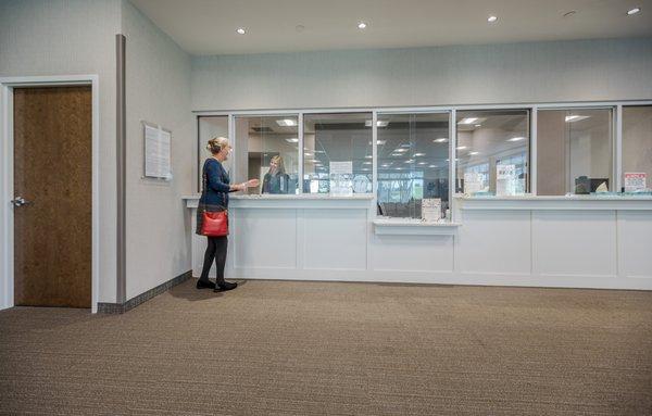 A patient checks in at Patient Registration at Augusta Oncology's downtown location.