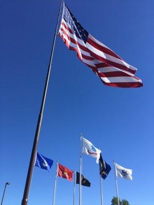 Flags Outside Of Our Range Road Location