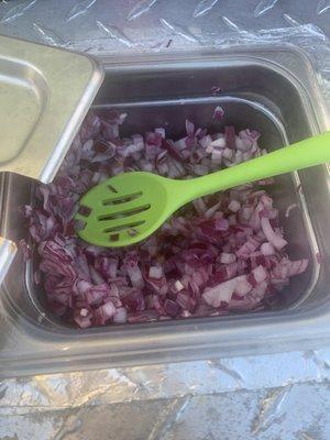 Red onions on the side of the truck