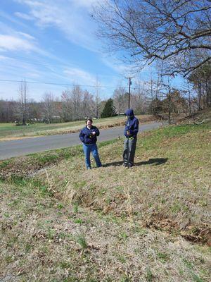 Missy Schmeing and her dad helping out on a boundary survey in Murray Kentucky