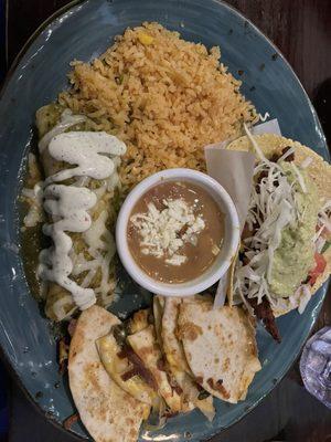 Combo plate with enchilada suizas, chicken milanesa taco, and quesadilla Guadalajara