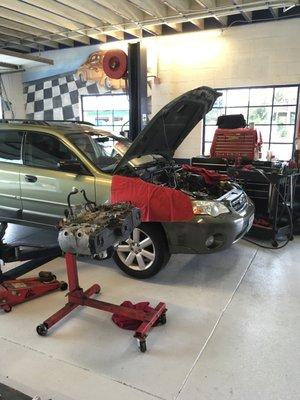 Engine removed for head gasket replacement on a Subaru Outback