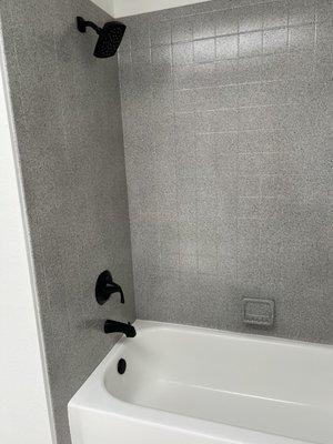 Resurfaced and repaired tub, resurfaced 30 year old 4x4 beige tile.