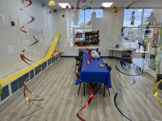 Party room for birthdays with racing ramp.