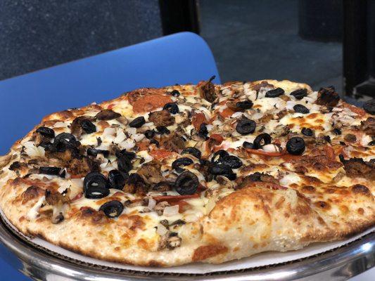 Build your own vegan pizza with vegan sausage, mushrooms, black olives and vegan pepperoni.