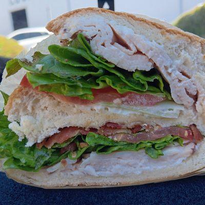 #13. Turkey Club 13.99 yummy club sandwich with lots of turkey and crispy bacon, lettuce, tomato, mayo, sliced in the middle