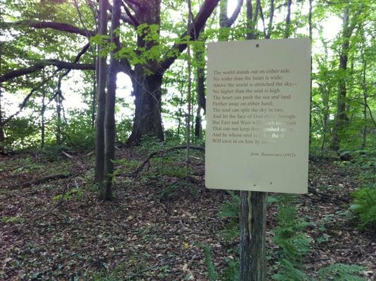 Signs like this one are scattered along the Poetry Trail leading to Millay's resting spot.