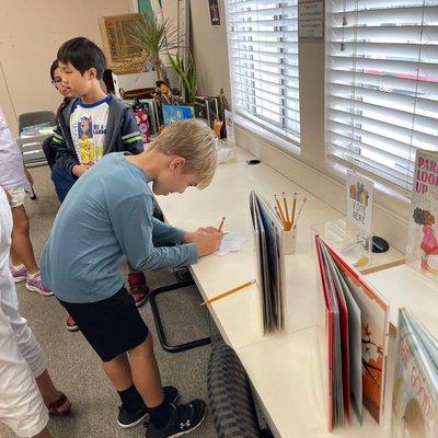 Voting for our favorite books at the library.