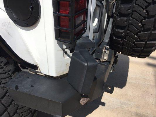 License plate bracket ripped off and dented in half after going through the car wash.