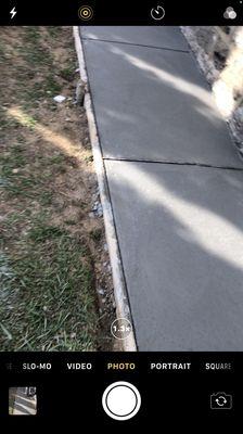 New concrete walkway around side of house