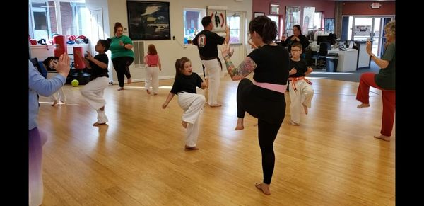 Little Panthers teaching their moms the knee strike.