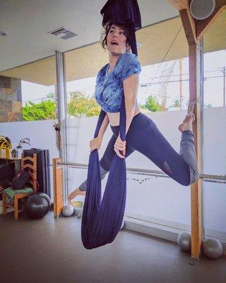 Aerial yoga! You get so strong in this class