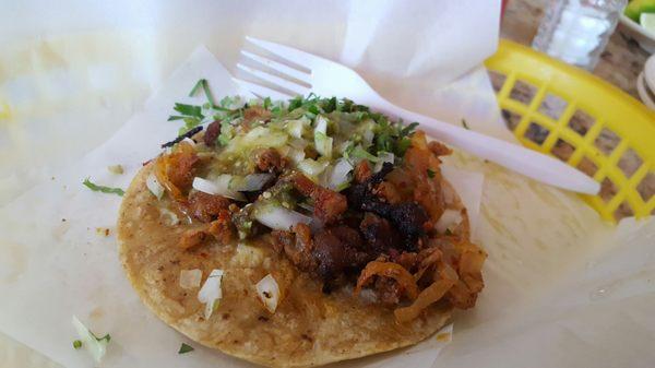 Taco de al pastor. Fork for scale