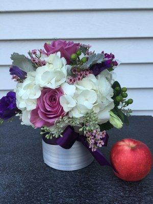 Cylinder of Hydrangea and roses.