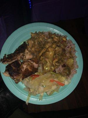 Curry chicken, jerk chicken, rice and peas, and cabbage