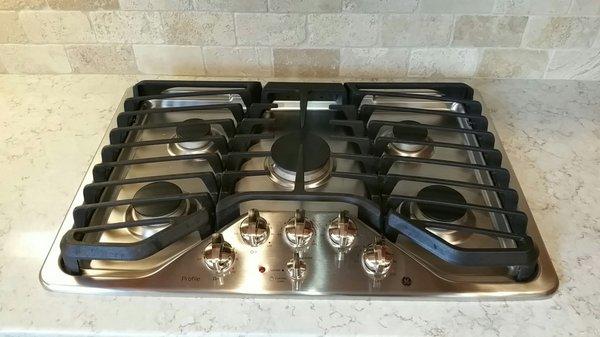 Stainless Steel stove top cleaned perfectly. All food, stains, and build up removed