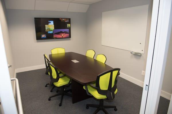 Conference room - seats up to six with display monitor and whiteboard.