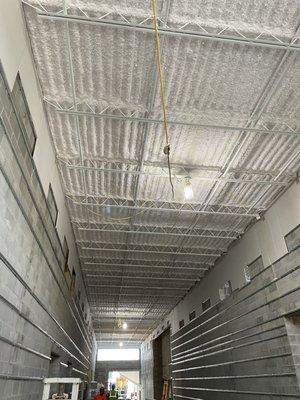 Areas of the building where Compass Insulation installed white K-13 sprayed acoustics insulation.