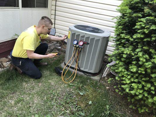 A tech performing a Tune-Up.