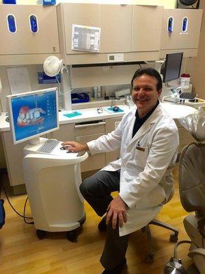 Dr. Montillo at the CEREC machine (for one day crowns!)