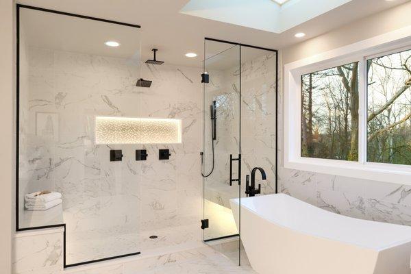 Stunning primary bath remodel. Marble tile throughout, exquisite elegance. A haven of luxury & relaxation.