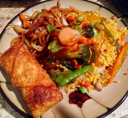 Egg roll, fried rice, pork lo mein, and chicken with garlic sauce