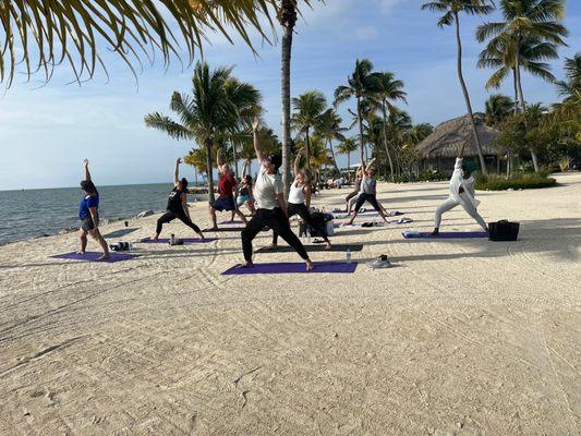 Beachfront yoga under the tiki!