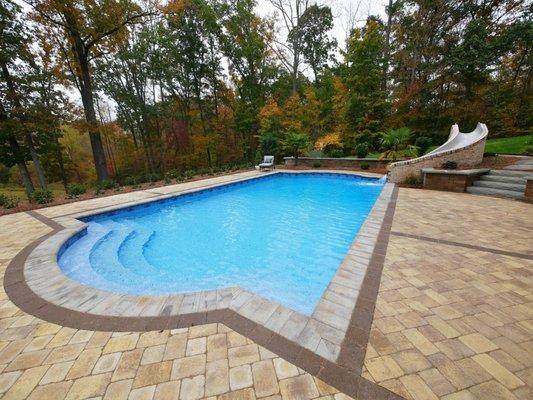 Classic Roman shaped pool with slide