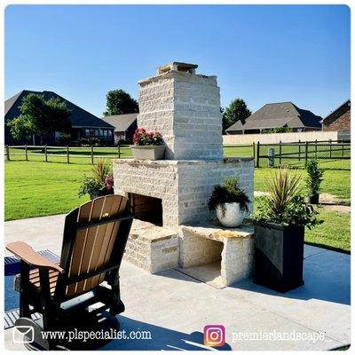 Custom outdoor fireplace and patio design along with installation.