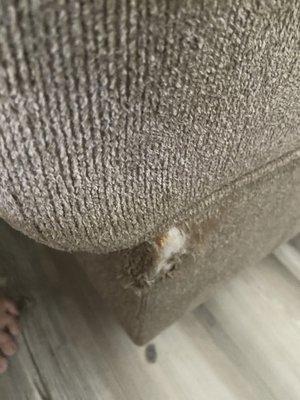 Sofa with ripped areas