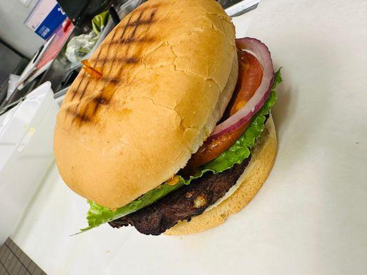 Santa Barbara Burger - blackbean veggie burger, lettuce, tomato, red onion, and Chipotle mayo served on a toasty Kaiser roll with a pickle