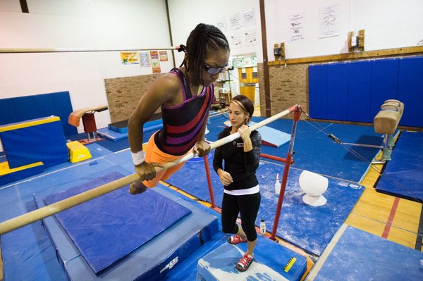 Somerville YMCA's competitive gymnastics team offers a supportive team environment for young athletes.