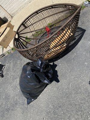 Egg shaped chair with cushion in a garbage bag at their location