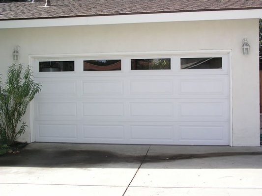 Long panel white garage door with windows