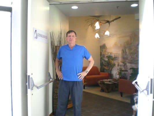 Dr Peters MD waiting to greet his first client after his morning workout and bike ride to the office.