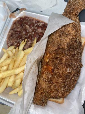 Whole fried cash dish with fries and red beans and rice