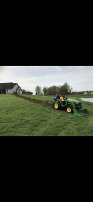 Trenching in pond fountain wiring.