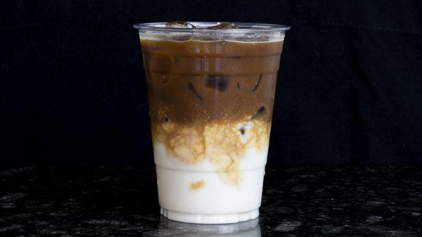 Iced Latte - Locally roasted Espresso and milk of choice (whole/oat) over ice.