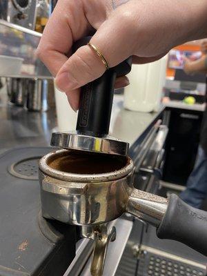 Incredible barista Carrie Ann pouring some espresso shots.