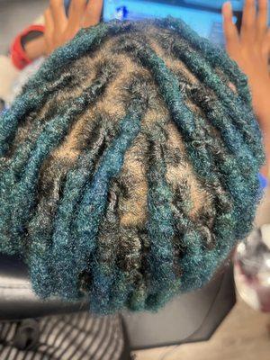 Color with this client wanting blue locs and a fresh retwist