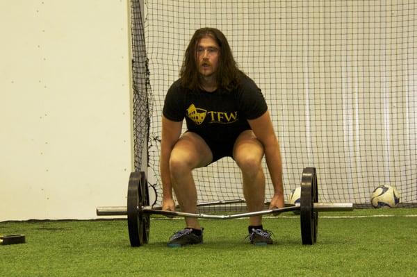 Matt killing hex bar deadlifts in the final round of a Training for Warriors Hurricane!