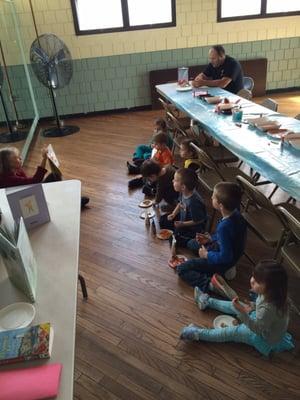 Patti reading a story while the kids enjoy a snack