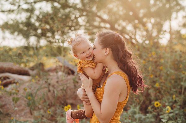 Snuggle kisses during family session