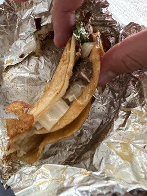 Side view of yummy $4 single Birria taco