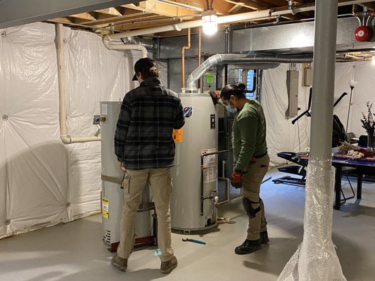 Tony and Jake getting ready to replace my old water heater with the new one.